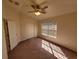 Bright bedroom with ceiling fan and double door closet at 18812 Duquesne Dr, Tampa, FL 33647