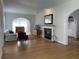 Living room features hardwood floors, fireplace, and an open floor plan at 2327 Woodlawn E Cir, St Petersburg, FL 33704