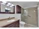 Updated bathroom with walk-in shower and dark wood vanity at 2351 Irish Ln # 21, Clearwater, FL 33763