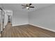 Bright bedroom with wood-look floors and ceiling fan at 2351 Irish Ln # 21, Clearwater, FL 33763