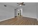 Primary bedroom with wood-look floors and ensuite bathroom at 2351 Irish Ln # 21, Clearwater, FL 33763