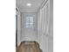 Hallway with coat closets and stained glass door at 2351 Irish Ln # 21, Clearwater, FL 33763