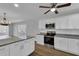 Kitchen with island, granite counters, and stainless steel appliances at 2351 Irish Ln # 21, Clearwater, FL 33763