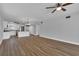 Open concept kitchen with stainless steel appliances and granite countertops at 2351 Irish Ln # 21, Clearwater, FL 33763
