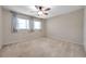 Spacious bedroom with carpeted floor and ceiling fan at 2402 Ecuadorian Way # 28, Clearwater, FL 33763