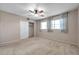 Spacious bedroom with carpeted floor, ceiling fan, and ample closet space at 2402 Ecuadorian Way # 28, Clearwater, FL 33763