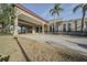Elegant community center entrance with palm trees at 2402 Ecuadorian Way # 28, Clearwater, FL 33763