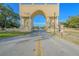 Grand entrance to the community with an archway and statuary at 2402 Ecuadorian Way # 28, Clearwater, FL 33763