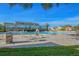 Large community pool with plenty of lounge chairs at 2402 Ecuadorian Way # 28, Clearwater, FL 33763