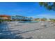 Resort-style pool with ample lounge chairs and umbrellas at 2402 Ecuadorian Way # 28, Clearwater, FL 33763