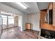 Open concept dining area with wood flooring and view to kitchen at 2402 Ecuadorian Way # 28, Clearwater, FL 33763