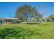 Community dog park with covered seating area and fenced-in areas at 2402 Ecuadorian Way # 28, Clearwater, FL 33763