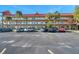 Condo building showcasing its architecture and parking lot at 2402 Ecuadorian Way # 28, Clearwater, FL 33763