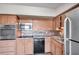 Updated kitchen with stainless steel appliances and wood cabinets at 2402 Ecuadorian Way # 28, Clearwater, FL 33763