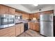 Bright kitchen, featuring stainless steel appliances and wood cabinets at 2402 Ecuadorian Way # 28, Clearwater, FL 33763