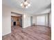 Spacious living room with wood floors and view of kitchen at 2402 Ecuadorian Way # 28, Clearwater, FL 33763