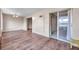 Living area with wood floors and sliding door to balcony at 2402 Ecuadorian Way # 28, Clearwater, FL 33763