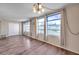 Living room features wood flooring and large windows at 2402 Ecuadorian Way # 28, Clearwater, FL 33763
