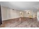 Bright living room featuring wood-look floors and a yellow chair at 2402 Ecuadorian Way # 28, Clearwater, FL 33763