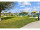 Community picnic area with tables, grills, and umbrellas at 2402 Ecuadorian Way # 28, Clearwater, FL 33763