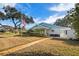 Front view of a light blue house at 272 Portree Dr, Dunedin, FL 34698