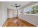 Bright bedroom with hardwood floors and an accent wall at 2724 20Th S St, St Petersburg, FL 33712