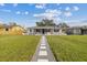 Newly renovated home with walkway and landscaped lawn at 2724 20Th S St, St Petersburg, FL 33712