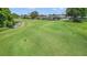 Golf course view with homes in background at 29526 Tee Shot Dr, San Antonio, FL 33576