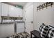 Bright laundry room with washer, dryer, and ample storage at 29526 Tee Shot Dr, San Antonio, FL 33576