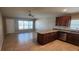 Kitchen with island featuring wooden cabinets and tile flooring at 301 E Grace St, Punta Gorda, FL 33950