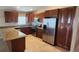 Spacious kitchen featuring stainless steel appliances and wooden cabinets at 301 E Grace St, Punta Gorda, FL 33950