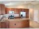 Spacious kitchen featuring stainless steel appliances and wooden cabinets at 301 E Grace St, Punta Gorda, FL 33950