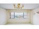 Bedroom with water view and chandelier at 31 Island Way # 703, Clearwater, FL 33767