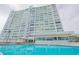 High rise building with pool and lush landscaping at 31 Island Way # 703, Clearwater, FL 33767