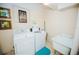 Shared laundry room with washer and dryer hookups, and a utility sink at 31 Island Way # 703, Clearwater, FL 33767