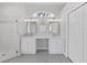 Bathroom with double vanity, patterned floor tile, and walk-in shower at 3307 Kilmer Pl, Plant City, FL 33566
