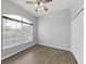 Bright bedroom with wood-look tile floors and double closets at 3307 Kilmer Pl, Plant City, FL 33566