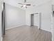 Bright bedroom with wood-look flooring and a large closet at 3307 Kilmer Pl, Plant City, FL 33566