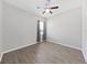Spacious bedroom with wood-look floors and ceiling fan at 3307 Kilmer Pl, Plant City, FL 33566