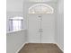 Bright and airy entryway with double doors and wood floor at 3307 Kilmer Pl, Plant City, FL 33566
