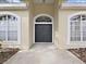 Elegant dark double front doors with arched window at 3307 Kilmer Pl, Plant City, FL 33566
