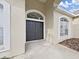 Front entrance with double doors and arched window detail at 3307 Kilmer Pl, Plant City, FL 33566