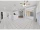 Bright kitchen with white cabinets, tile floors, and island at 3307 Kilmer Pl, Plant City, FL 33566