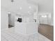 Open concept kitchen with breakfast bar and access to Gathering room at 3307 Kilmer Pl, Plant City, FL 33566