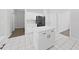 Modern kitchen with white cabinets and an island at 3307 Kilmer Pl, Plant City, FL 33566