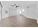 Spacious living area with wood-look tile flooring and high ceilings at 3307 Kilmer Pl, Plant City, FL 33566