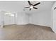 Large living room with tile floors and double doors at 3307 Kilmer Pl, Plant City, FL 33566