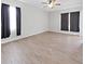 Spacious living room featuring wood-look floors and ceiling fan at 3307 Kilmer Pl, Plant City, FL 33566