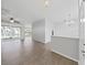 Spacious living room with wood-look tile flooring and access to a patio at 3307 Kilmer Pl, Plant City, FL 33566