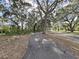 Paved path winds through a tree-lined neighborhood at 3307 Kilmer Pl, Plant City, FL 33566